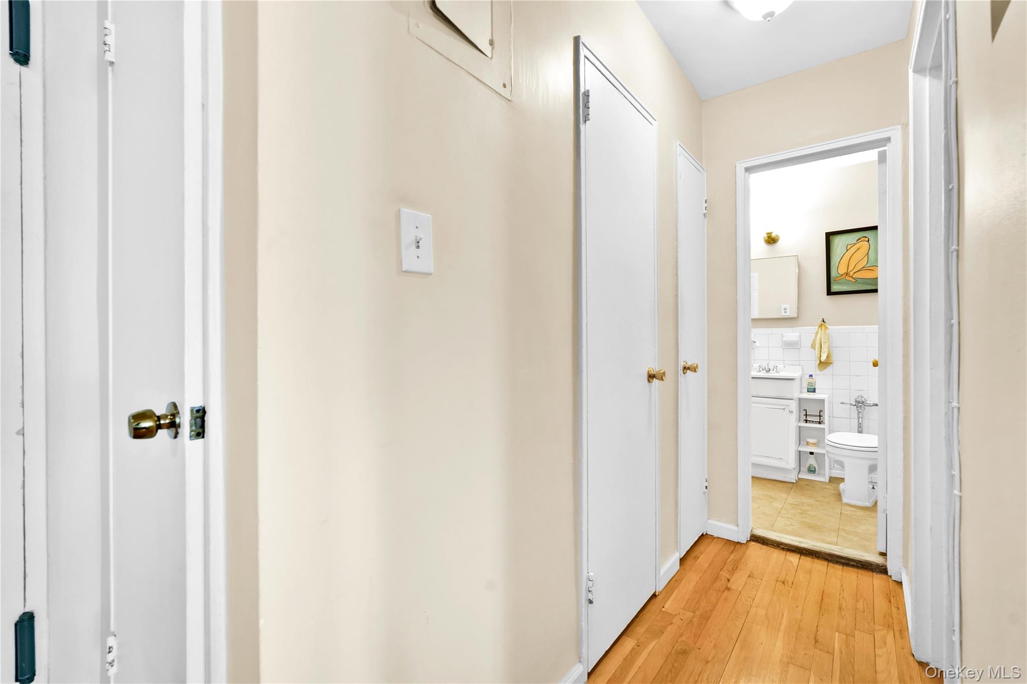 209-10 41st Avenue, Unit 2J Queens, NY 11361 - Photo 19 of 35 a bathroom with a tub and shower