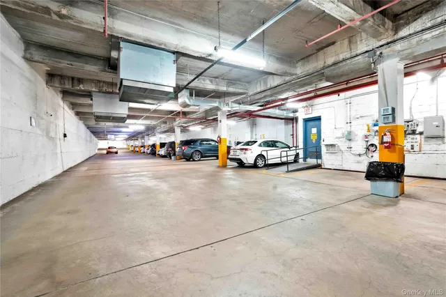 a view of parking garage with cars
