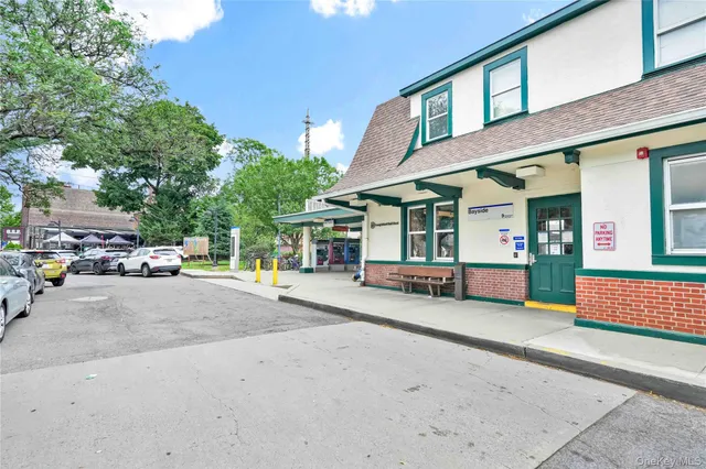 a view of a building with car parked