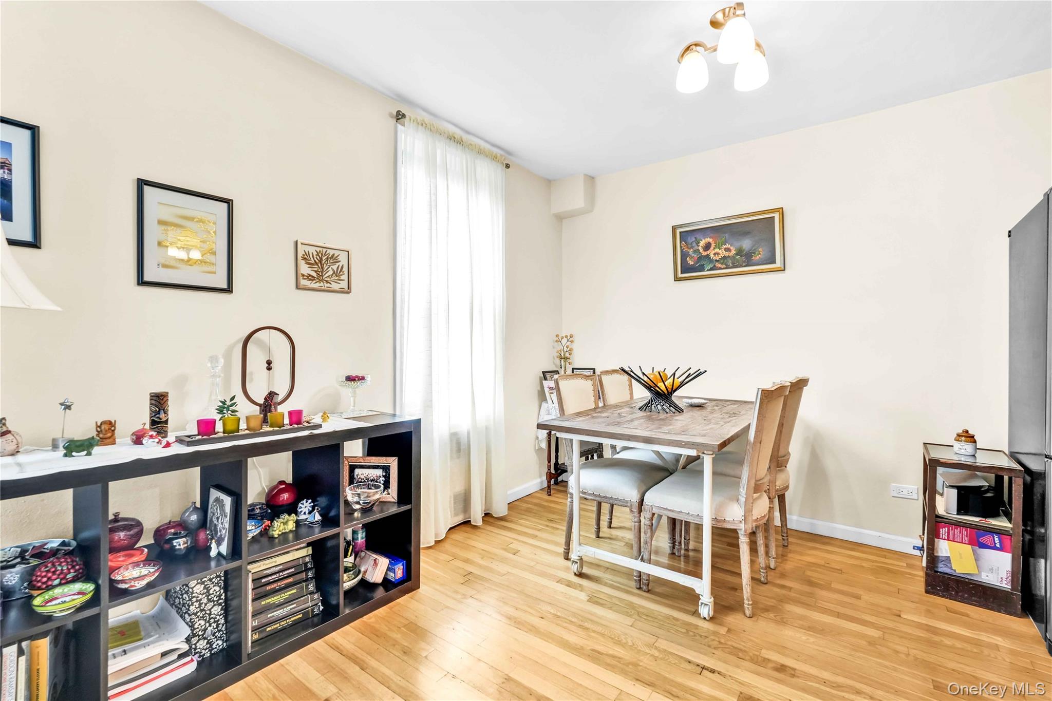 209-10 41st Avenue, Unit 2J Queens, NY 11361 - Photo 7 of 35 a view of a dining room with furniture and a kitchen