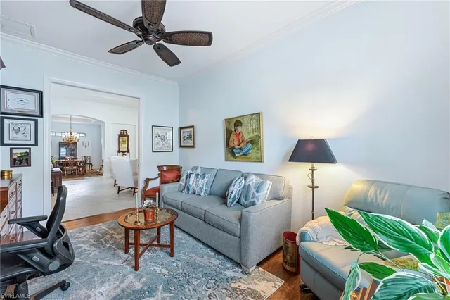 a living room with furniture and a lamp