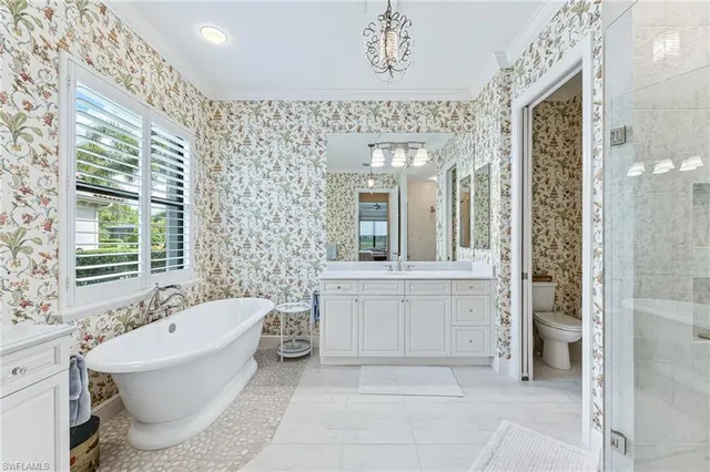 a spacious bathroom with a bathtub shower and a sink
