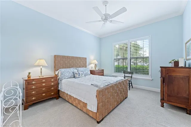 a bedroom with a bed dresser and a window