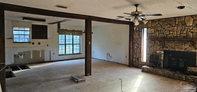 a living room with a couch and a fireplace