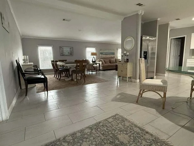 a lobby with furniture and a potted plant