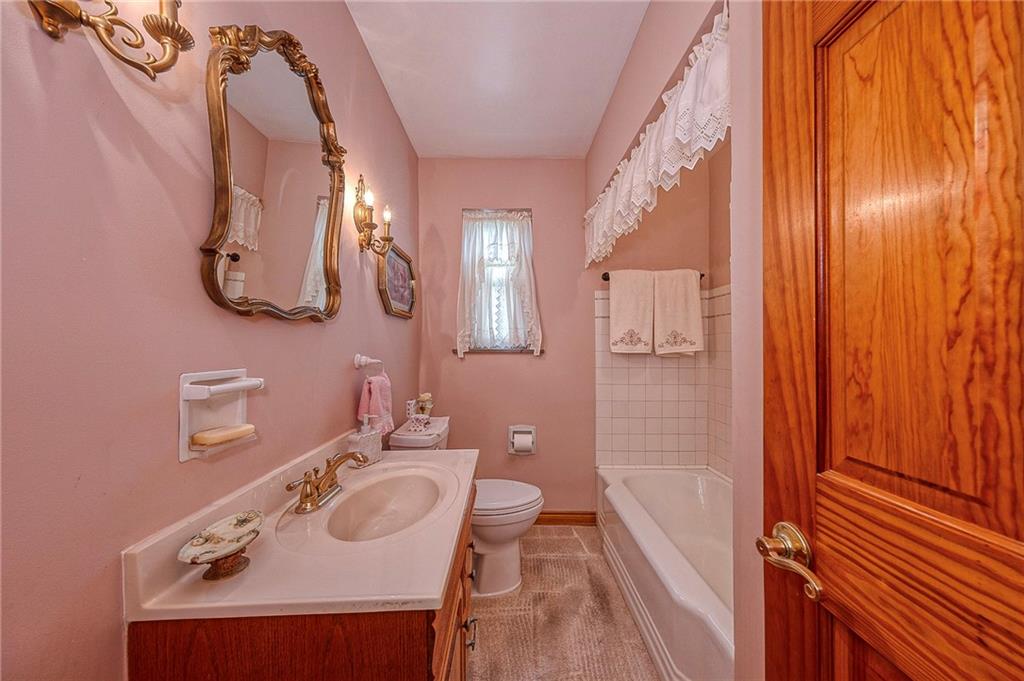 699 Kaye Avenue Monaca, PA 15061 - Photo 19 of 43 a bathroom with a sink and mirror with toilet