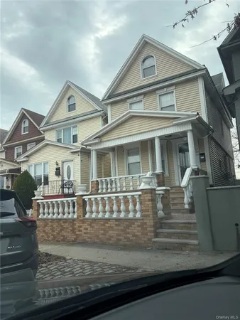 a front view of a house with yard