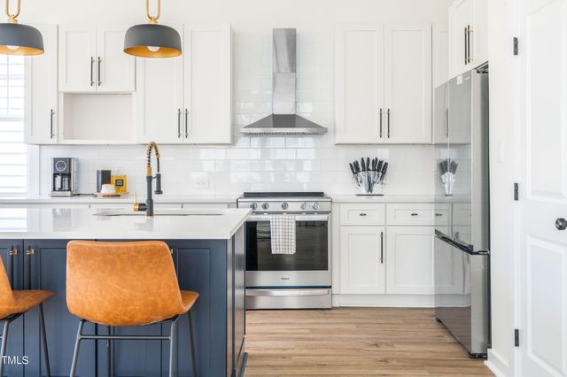 a view of living room with granite countertop furniture and a wooden floor