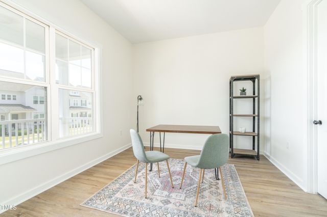 a bathroom with a granite countertop bathtub shower sink vanity and toilet