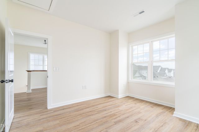 a bathroom with a granite countertop sink a mirror and a bathtub