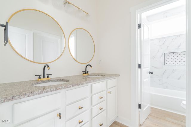 a bathroom with a toilet and a bathtub