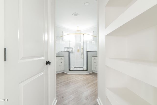 a spacious bathroom with a granite countertop sink and a mirror