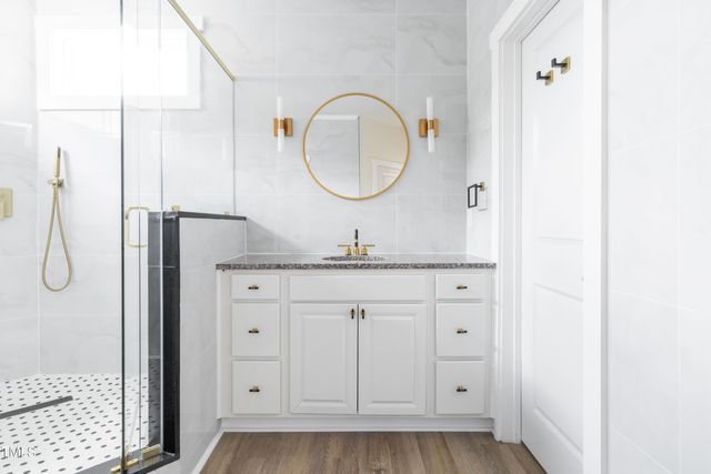 a bathroom with a sink and a mirror