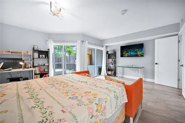 a spacious bathroom with a double vanity sink a mirror and a shower
