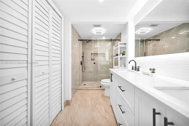 a bathroom with a shower and toilet