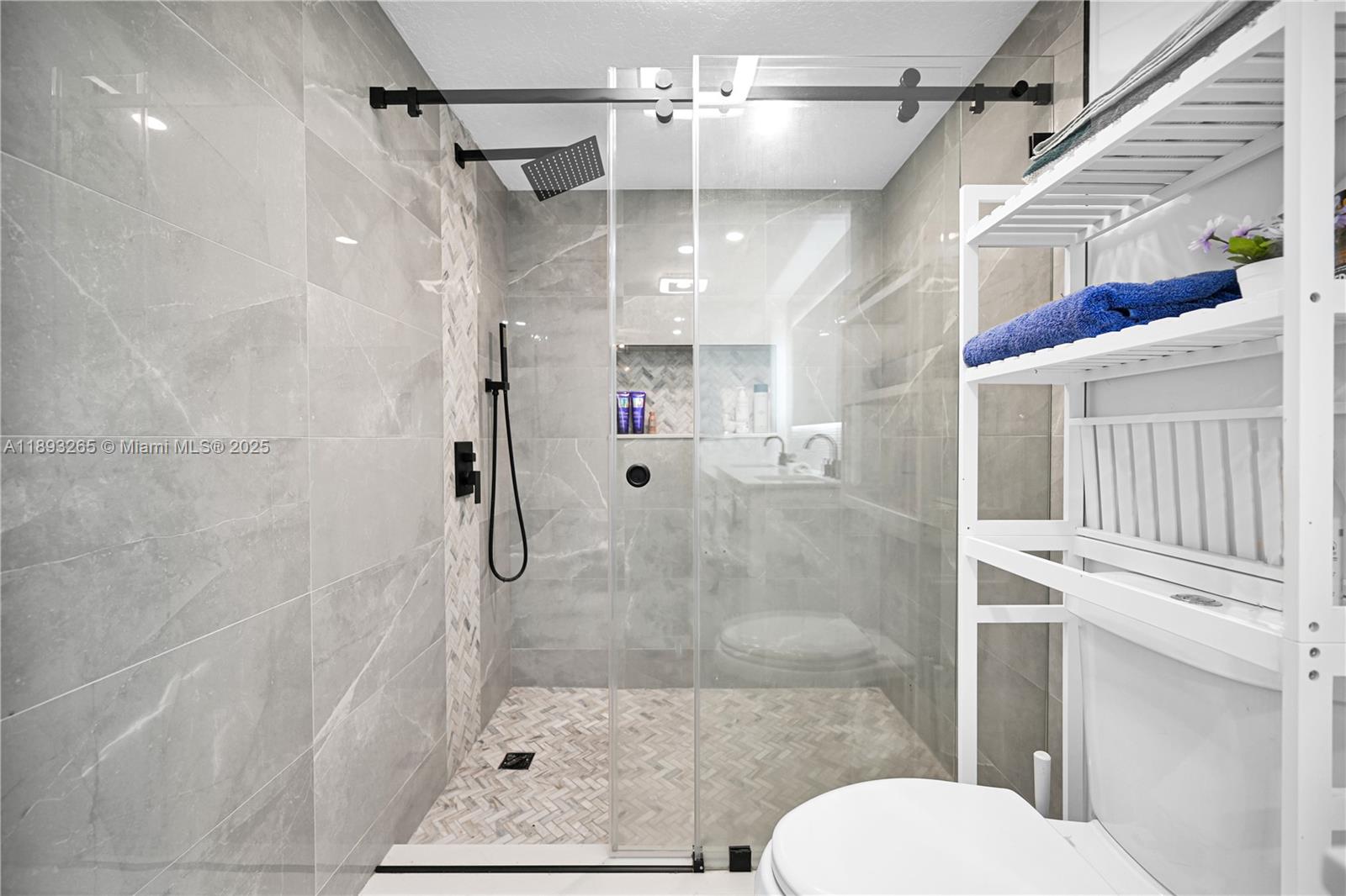 10101 Southwest 154th Cir Court, Unit 10711 Miami, FL 33196 - Photo 13 of 63 a bathroom with a shower and toilet