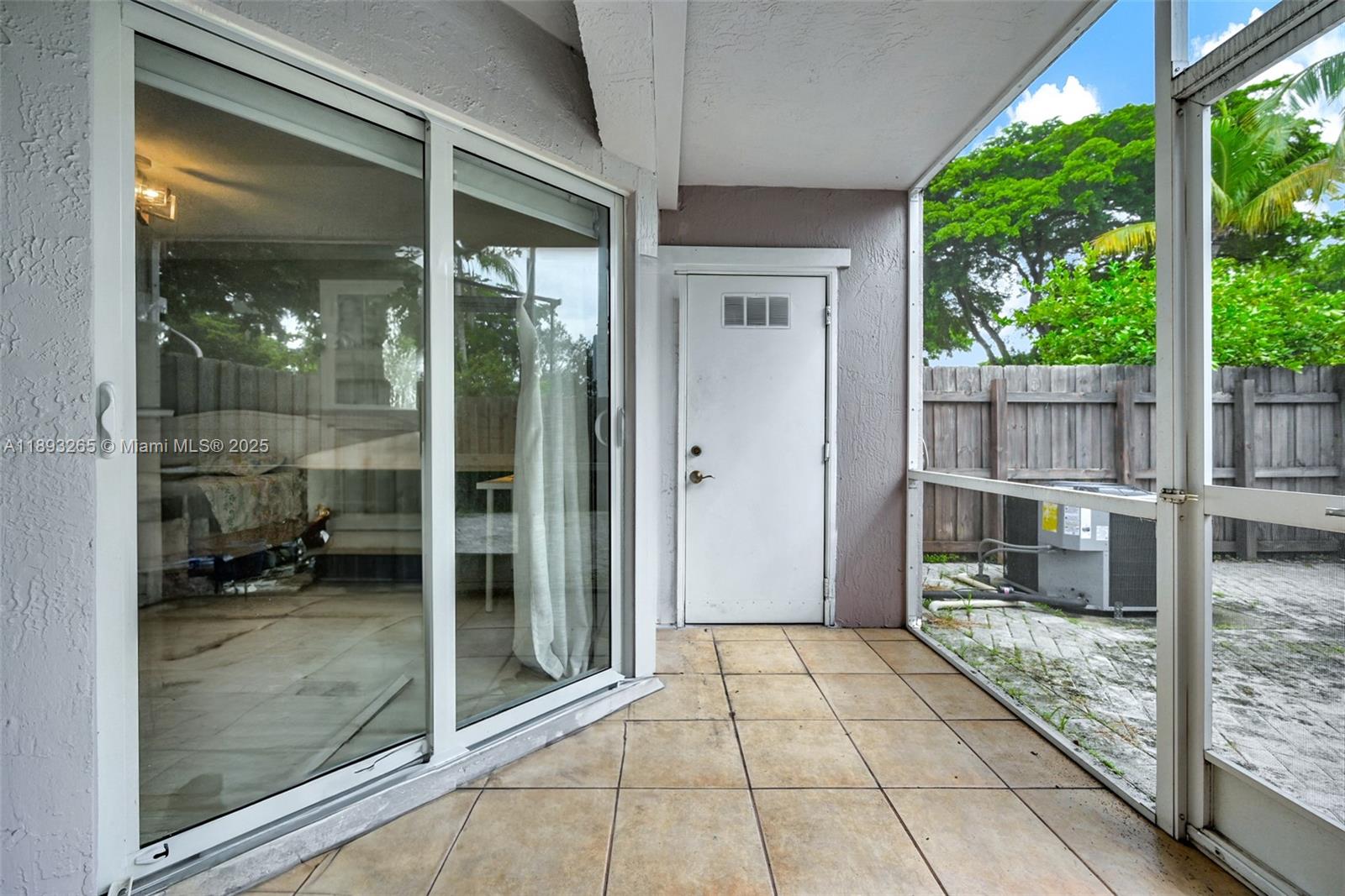 10101 Southwest 154th Cir Court, Unit 10711 Miami, FL 33196 - Photo 19 of 63 a view of a glass door of the house