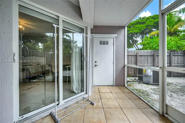 a view of a glass door and a door of a house