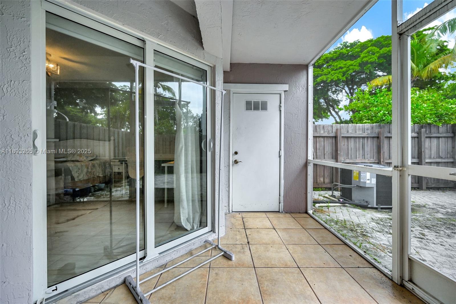 10101 Southwest 154th Cir Court, Unit 10711 Miami, FL 33196 - Photo 21 of 63 a view of a glass door of the house