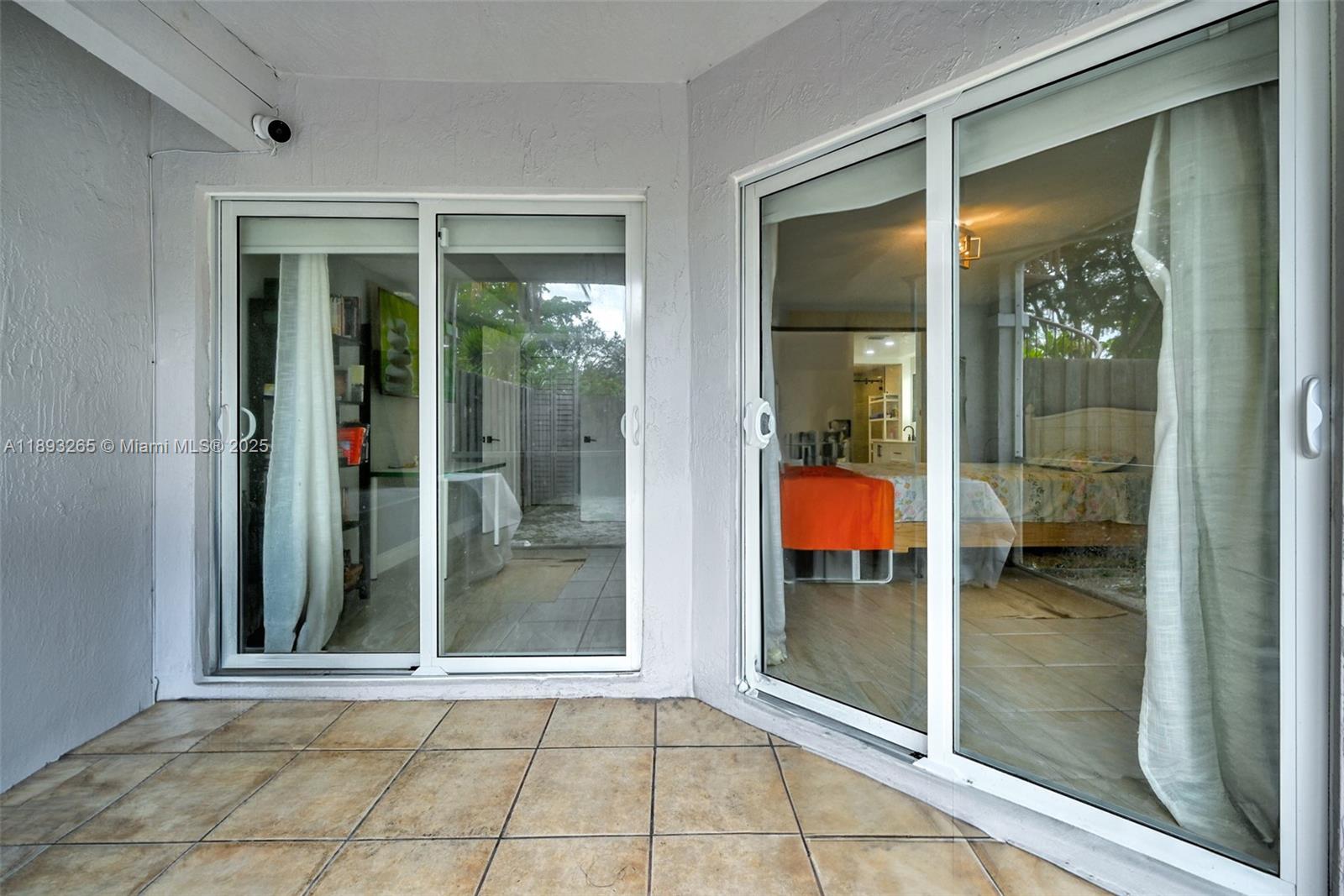 10101 Southwest 154th Cir Court, Unit 10711 Miami, FL 33196 - Photo 22 of 63 a view of a glass door and a door of a house