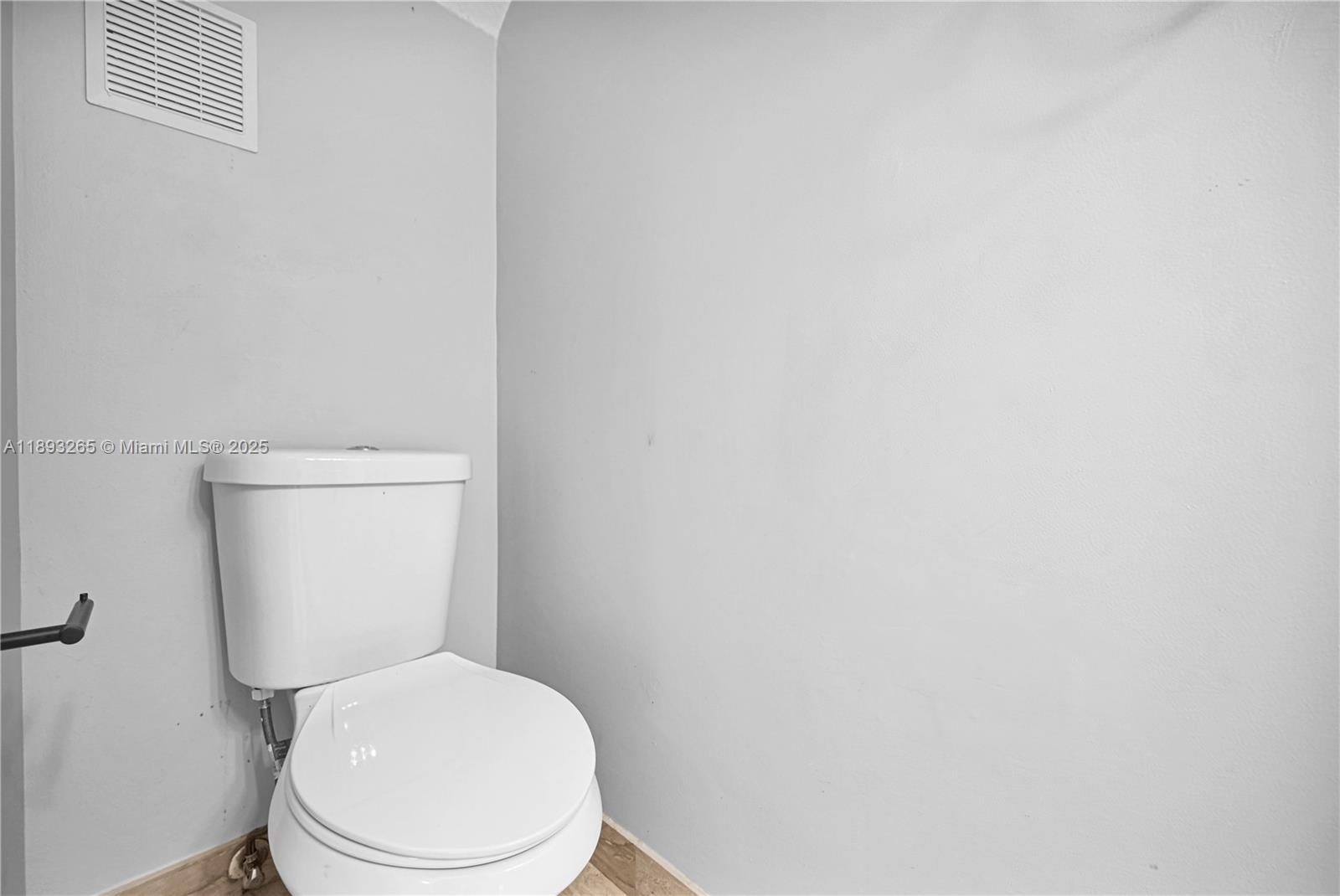 10101 Southwest 154th Cir Court, Unit 10711 Miami, FL 33196 - Photo 30 of 63 a white toilet sitting next to a white wall