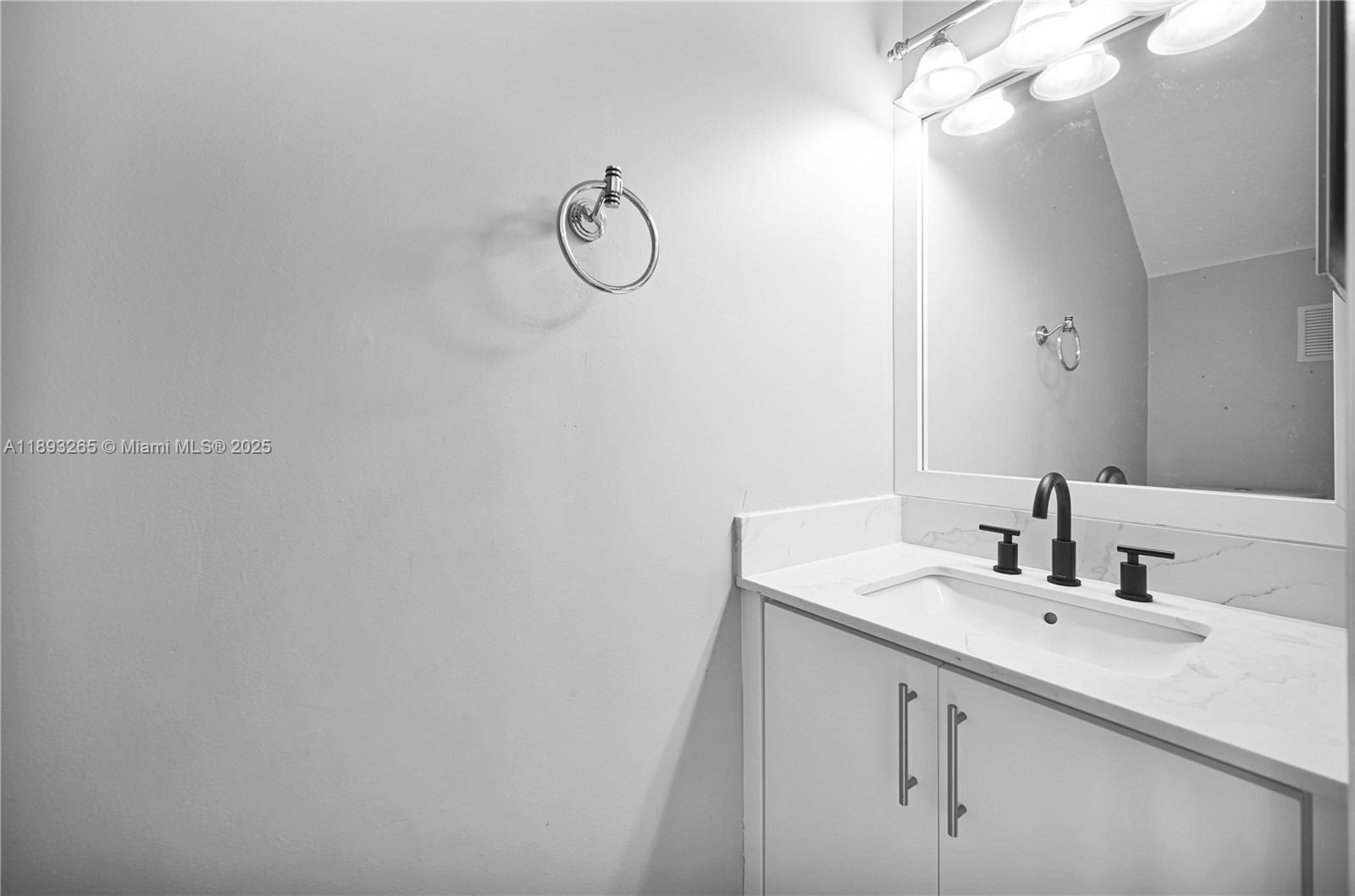 10101 Southwest 154th Cir Court, Unit 10711 Miami, FL 33196 - Photo 31 of 63 a bathroom with a sink and a mirror