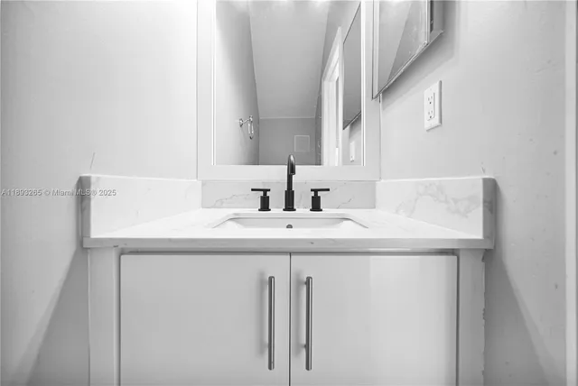 a kitchen with stainless steel appliances granite countertop a stove and a microwave