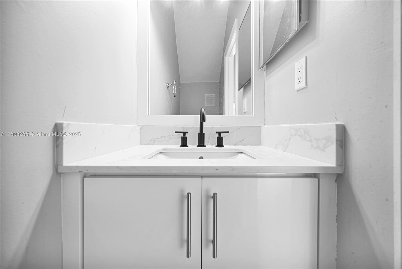 10101 Southwest 154th Cir Court, Unit 10711 Miami, FL 33196 - Photo 32 of 63 a bathroom with a sink and a mirror