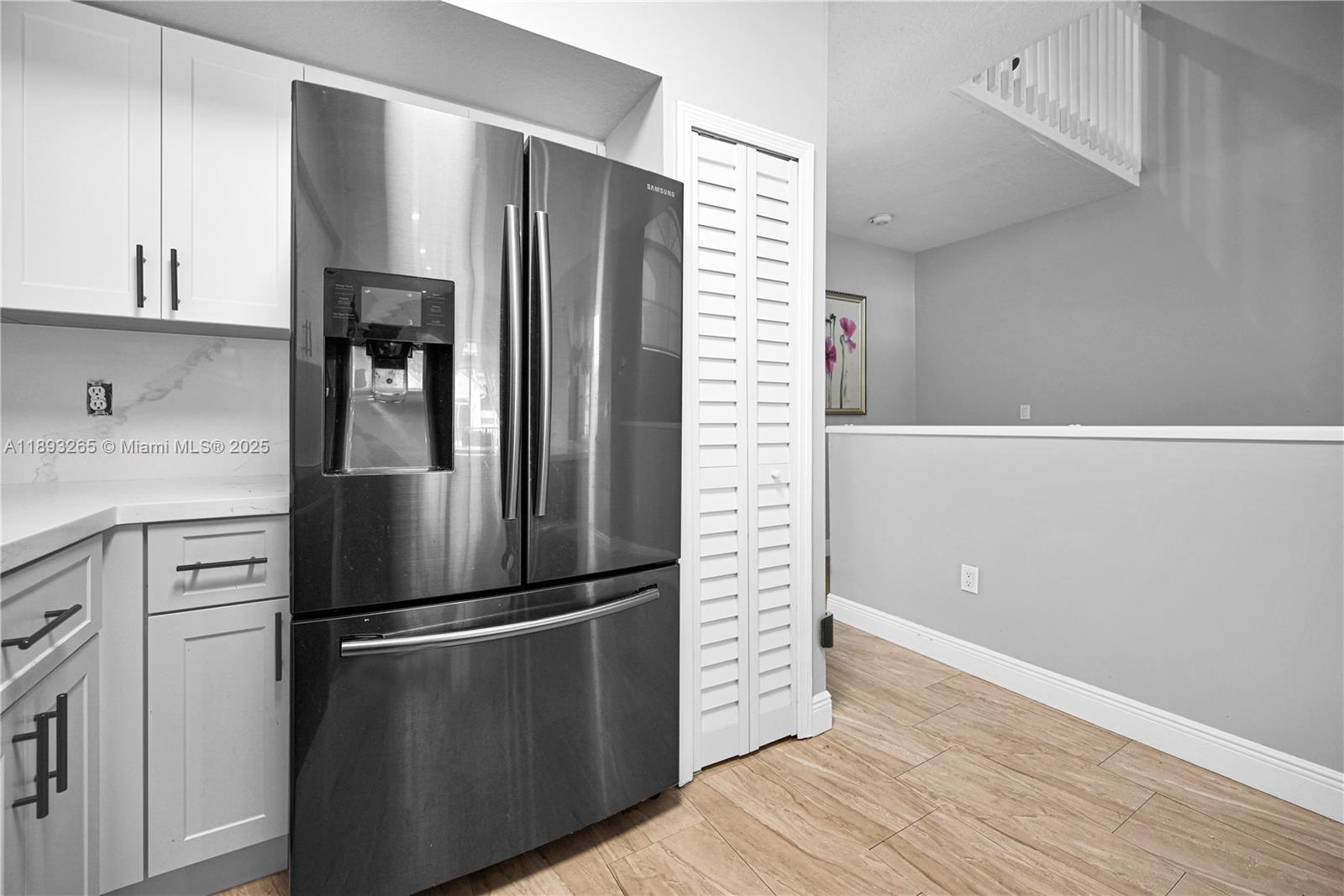 10101 Southwest 154th Cir Court, Unit 10711 Miami, FL 33196 - Photo 37 of 63 a metallic refrigerator freezer sitting in a kitchen