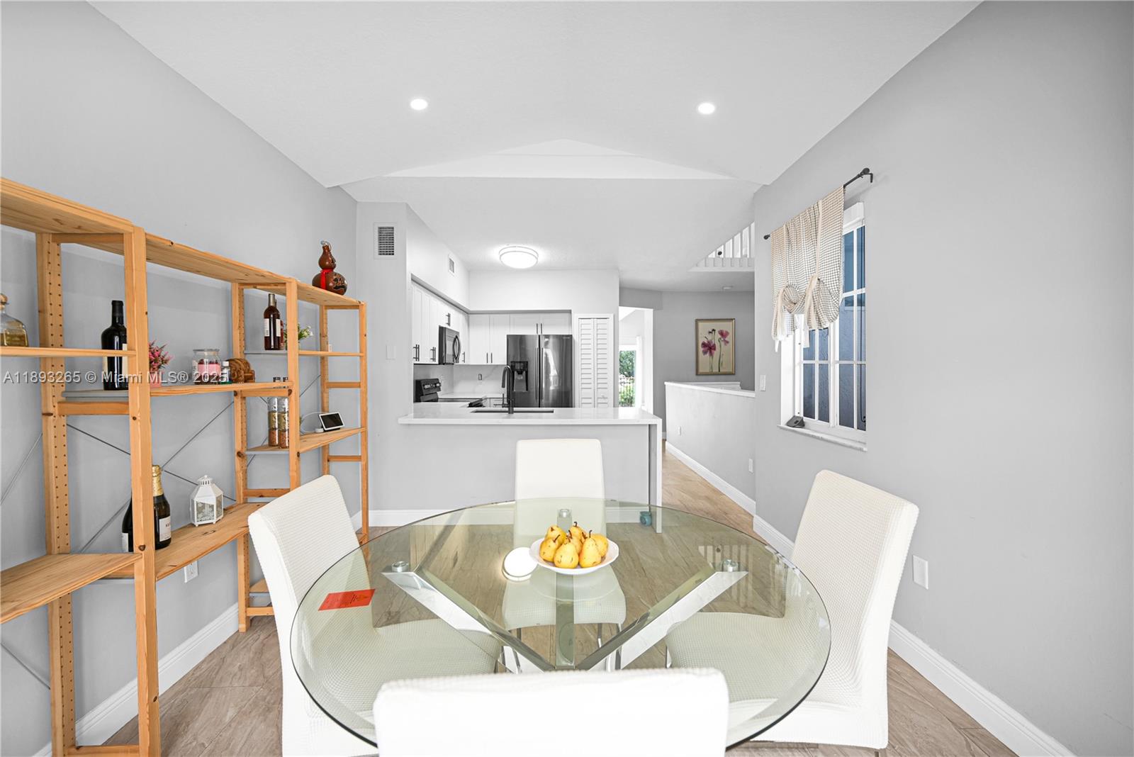 10101 Southwest 154th Cir Court, Unit 10711 Miami, FL 33196 - Photo 40 of 63 a living room with stainless steel appliances furniture dining table and chairs