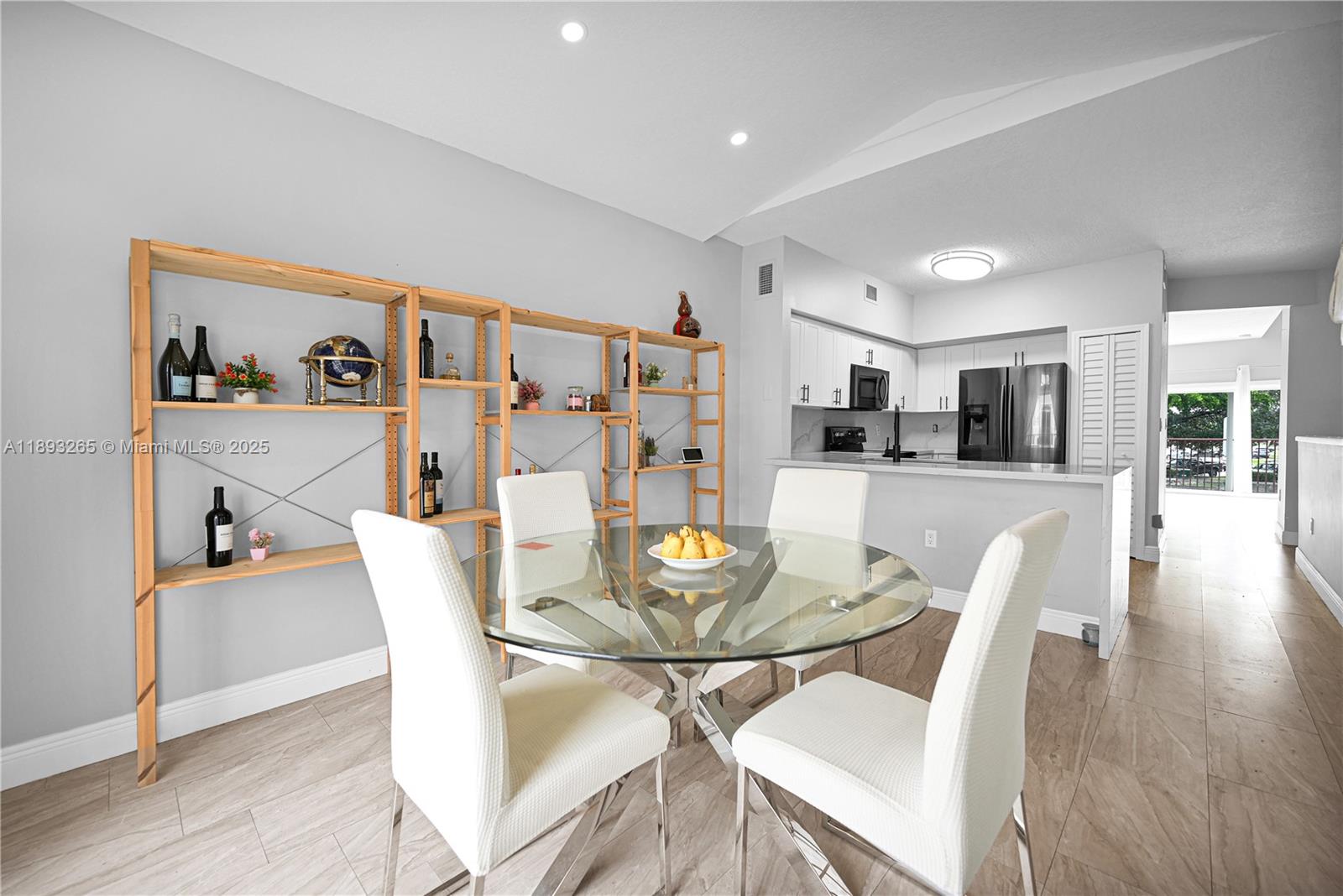 10101 Southwest 154th Cir Court, Unit 10711 Miami, FL 33196 - Photo 41 of 63 a dining room with furniture and wooden floor