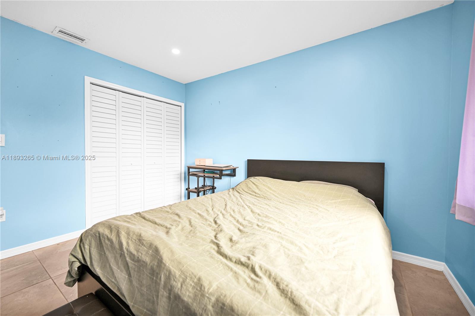 10101 Southwest 154th Cir Court, Unit 10711 Miami, FL 33196 - Photo 51 of 63 a large bed sitting in a bedroom next to a window