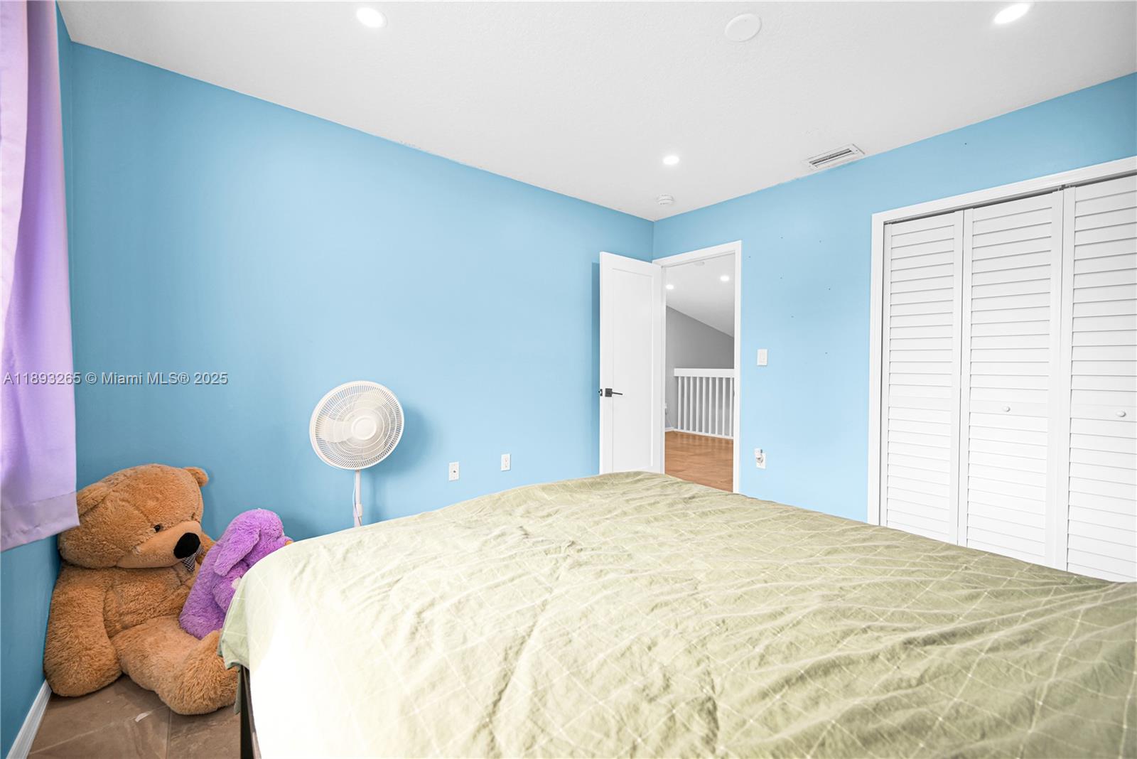 10101 Southwest 154th Cir Court, Unit 10711 Miami, FL 33196 - Photo 52 of 63 a bedroom with a bed and teddy bear on bed