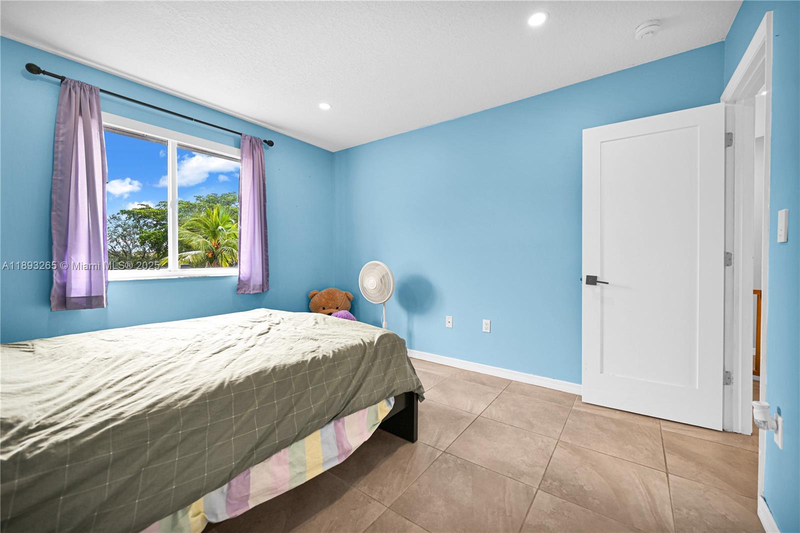 10101 Southwest 154th Cir Court, Unit 10711 Miami, FL 33196 - Photo 53 of 63 a bedroom with a bed and a window