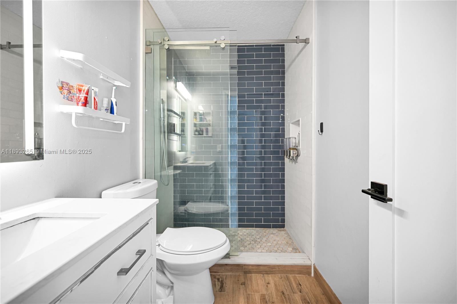 10101 Southwest 154th Cir Court, Unit 10711 Miami, FL 33196 - Photo 54 of 63 a bathroom with a sink toilet and shower