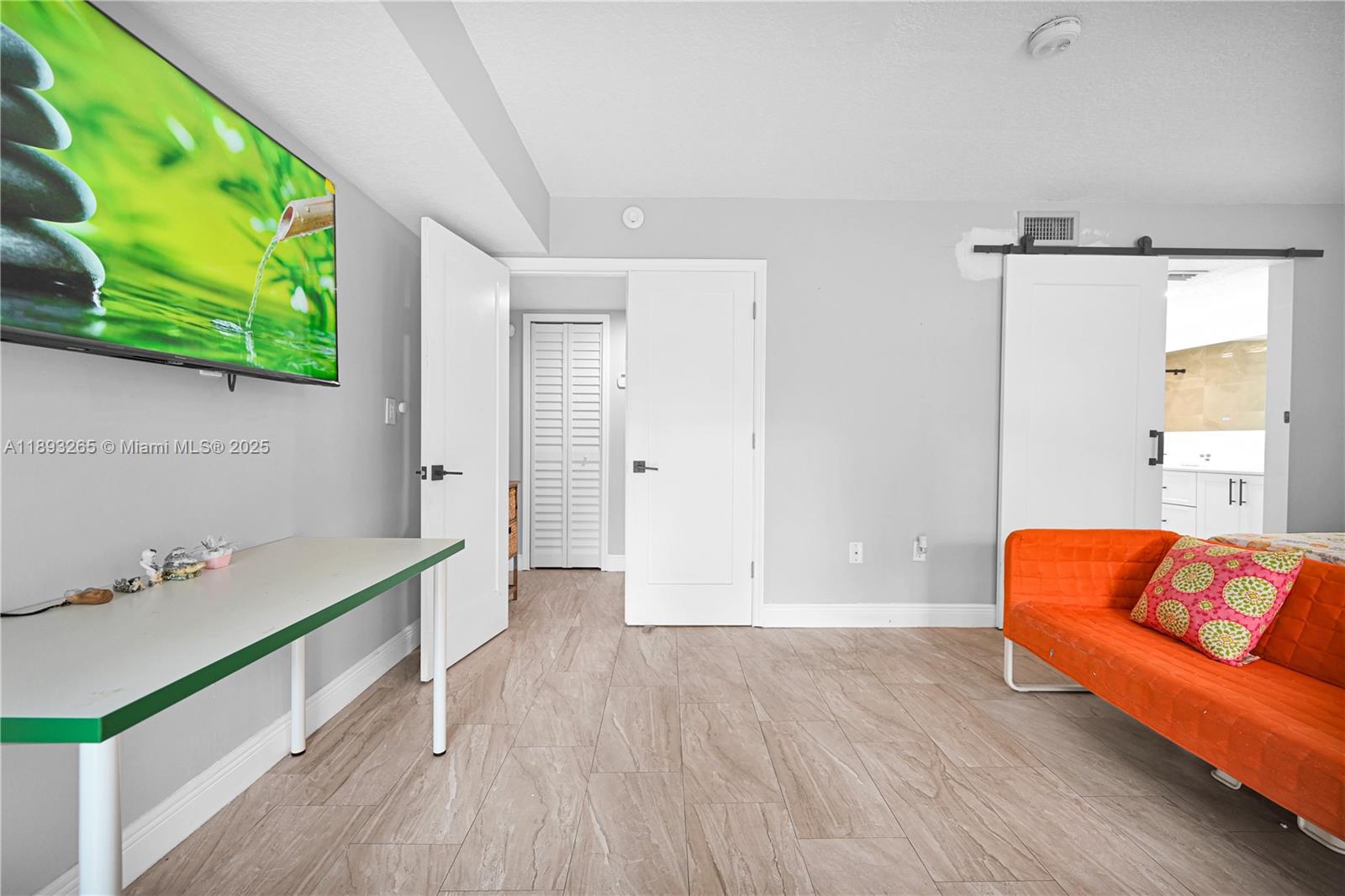 10101 Southwest 154th Cir Court, Unit 10711 Miami, FL 33196 - Photo 8 of 63 a view of room with window and wooden floor