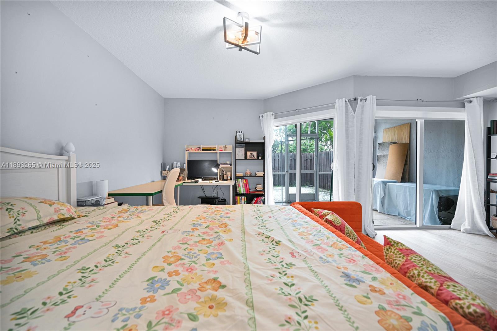 10101 Southwest 154th Cir Court, Unit 10711 Miami, FL 33196 - Photo 10 of 63 a bedroom with a large bed and a large window