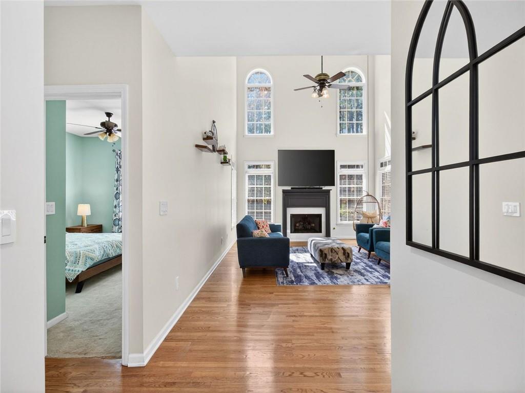 8840 Appling Ridge Cumming, GA 30041 - Photo 12 of 87 a living room with furniture and a fireplace