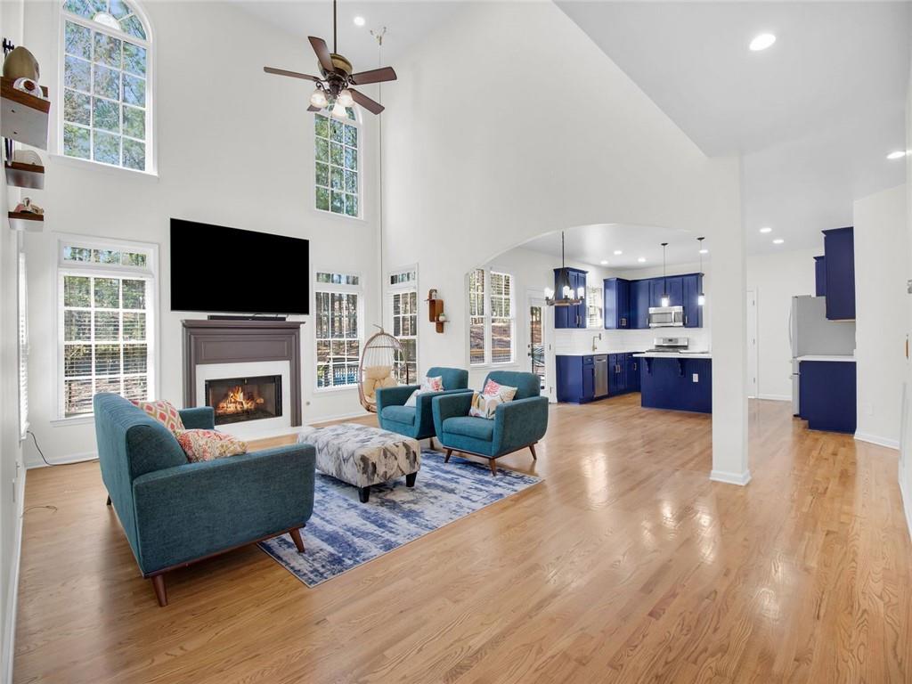 8840 Appling Ridge Cumming, GA 30041 - Photo 14 of 87 a living room with furniture fireplace and flat screen tv