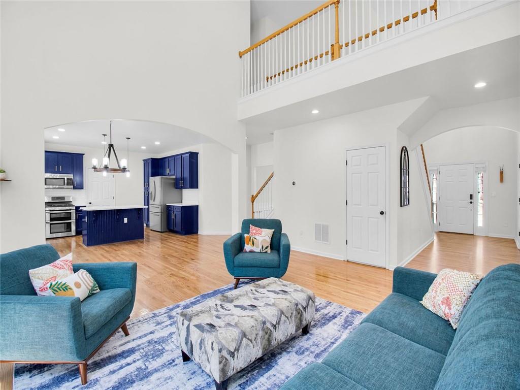 8840 Appling Ridge Cumming, GA 30041 - Photo 15 of 87 a living room with furniture and kitchen view
