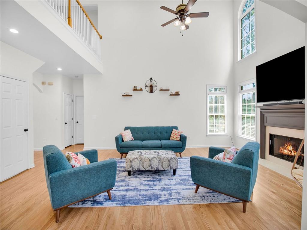 8840 Appling Ridge Cumming, GA 30041 - Photo 16 of 87 a living room with furniture fireplace and flat screen tv