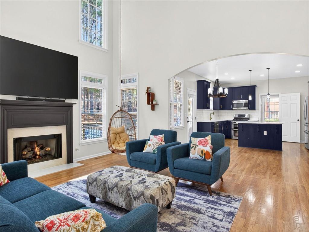 8840 Appling Ridge Cumming, GA 30041 - Photo 20 of 87 a living room with furniture fireplace and flat screen tv
