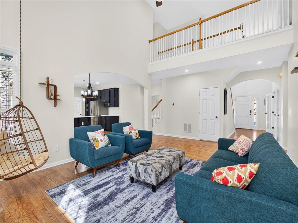 8840 Appling Ridge Cumming, GA 30041 - Photo 21 of 87 a living room with furniture and wooden floor
