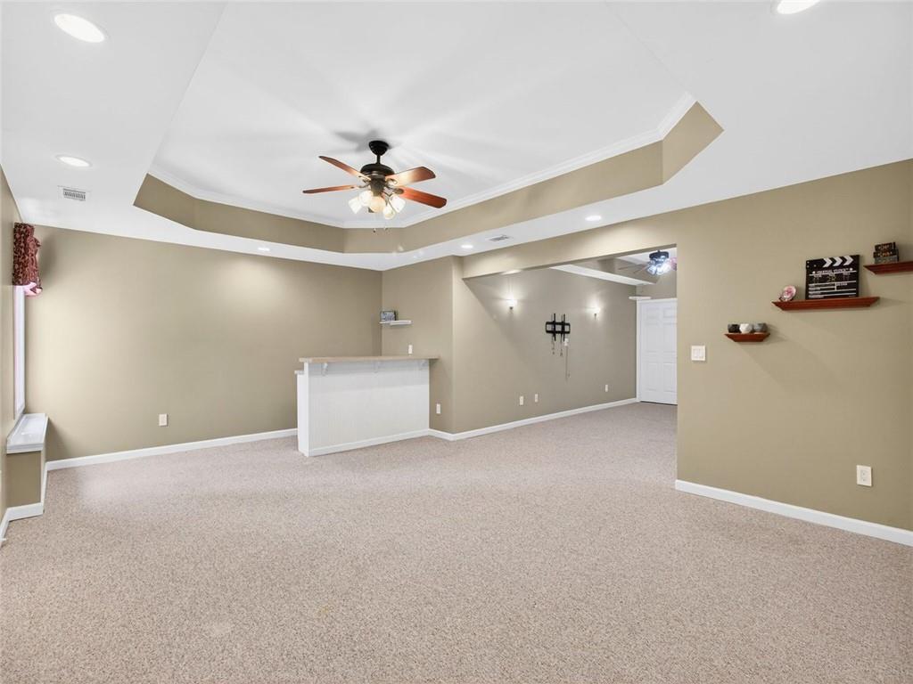8840 Appling Ridge Cumming, GA 30041 - Photo 57 of 87 a view of an empty room with a ceiling fan