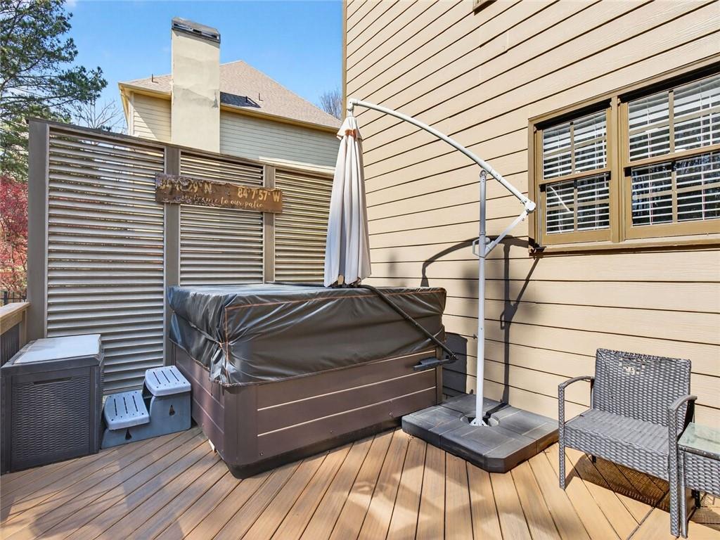 8840 Appling Ridge Cumming, GA 30041 - Photo 65 of 87 a view of a patio with a table and chairs