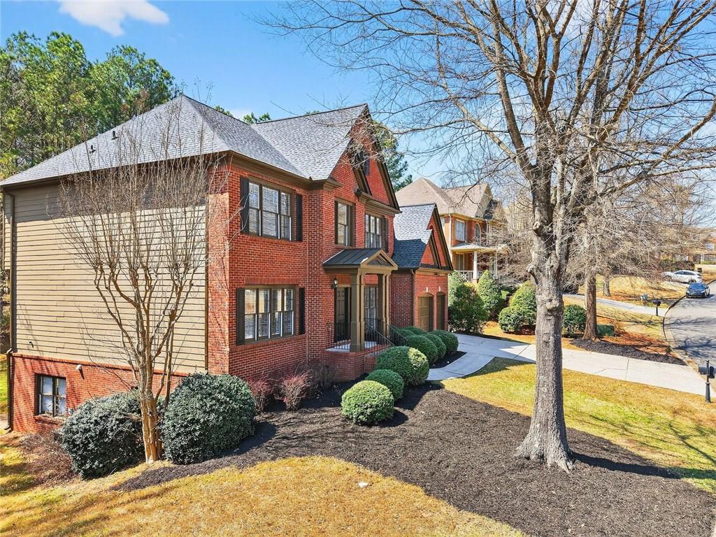 8840 Appling Ridge Cumming, GA 30041 - Photo 75 of 87 a view of a house with backyard and sitting area