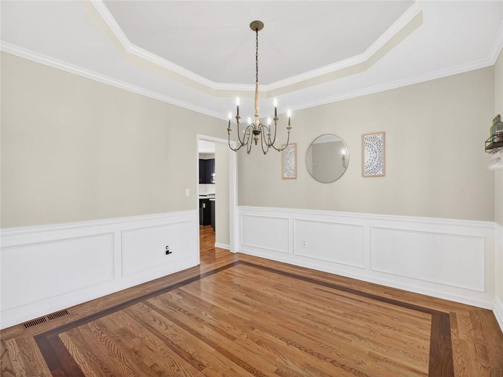 8840 Appling Ridge Cumming, GA 30041 - Photo 9 of 87 a view of a chandelier in big room and chandelier fan