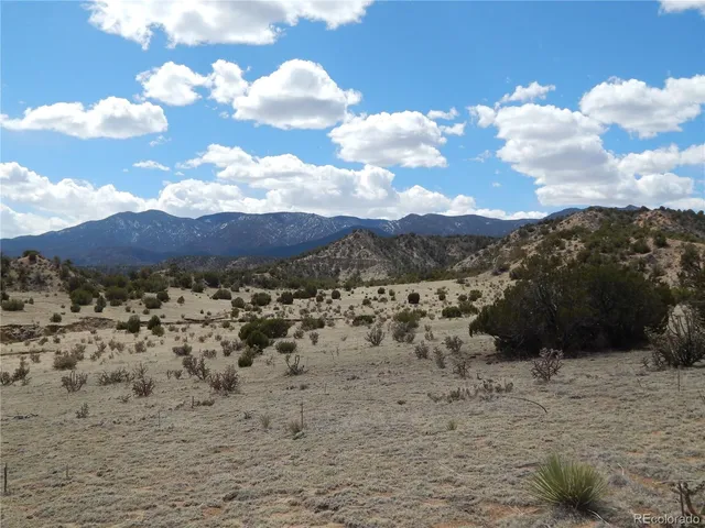 a view of a large body of water with a mountain in the background