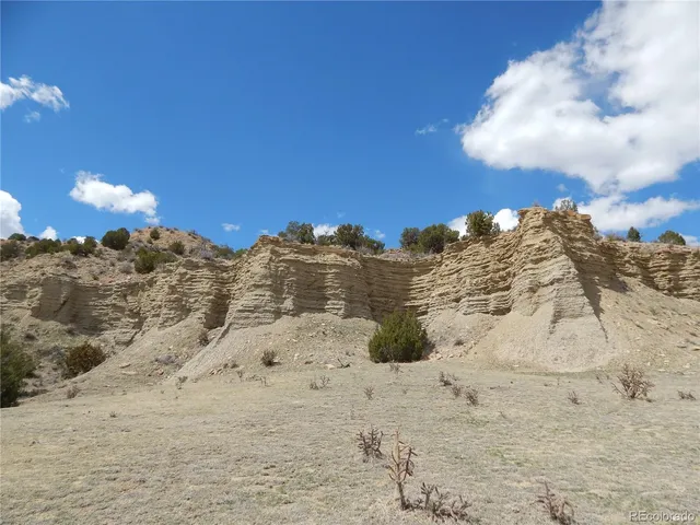 a view of a large building with a mountain in the background