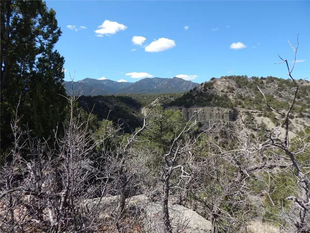 a view of a houses with a mountain